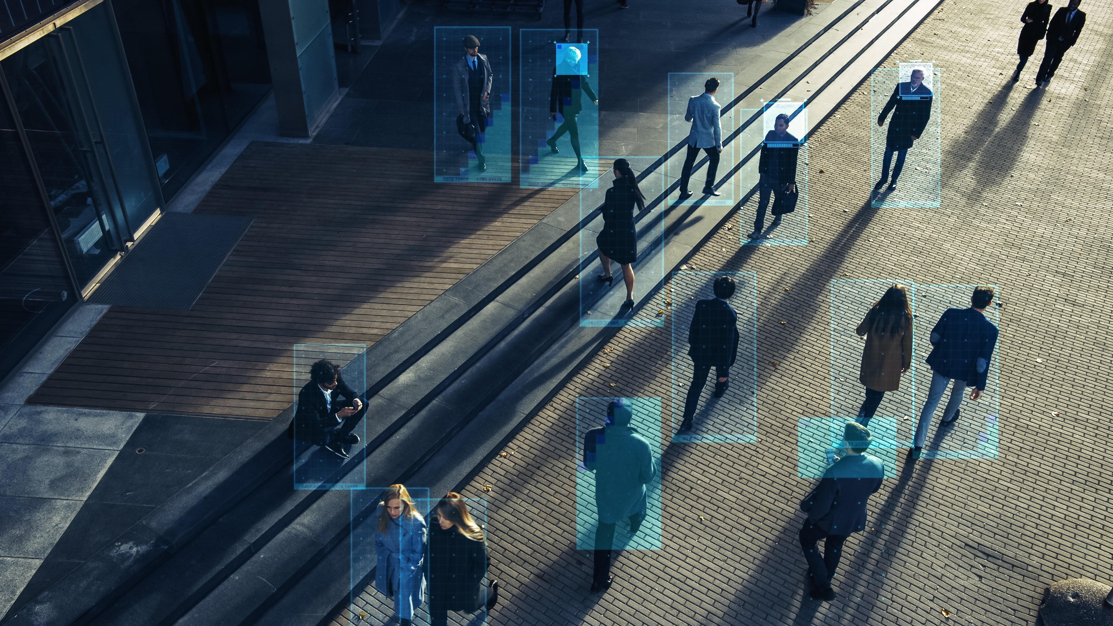 people on street filmed by facial recognition